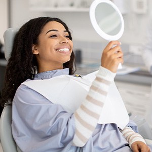 Woman smiling with new dental crowns