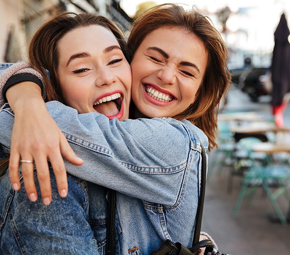 Happy Fort Worth patient smiling with a friend