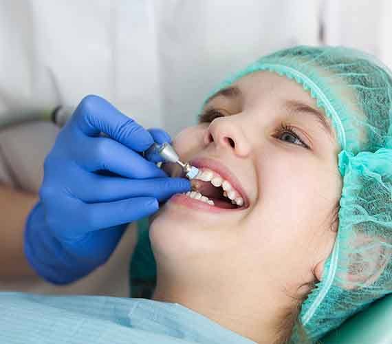 A dentist showing a patient’s smile to them