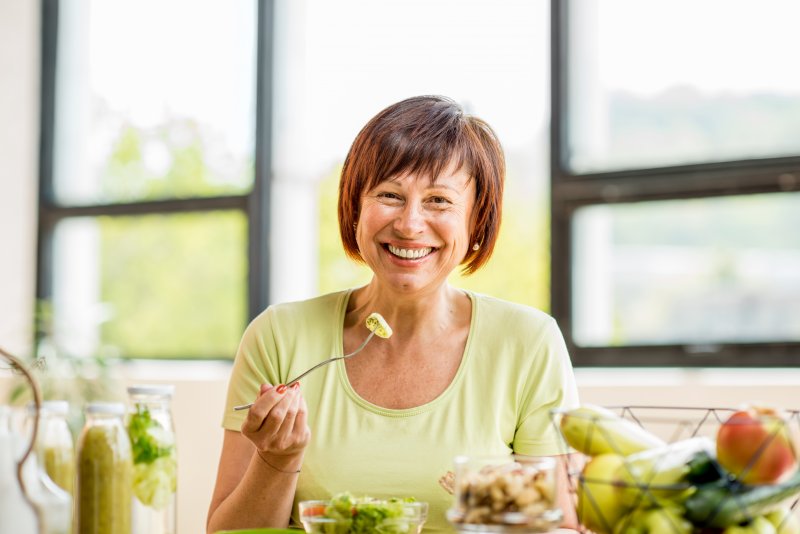 Patient eating with dentures