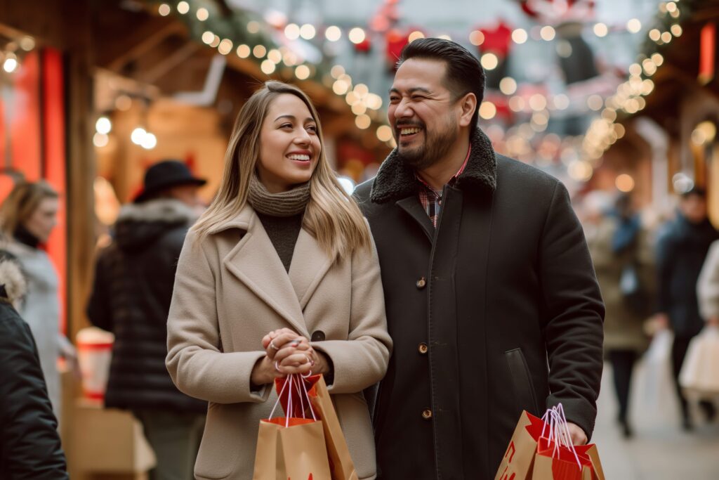 Couple smiling while shopping at outdoor holiday market